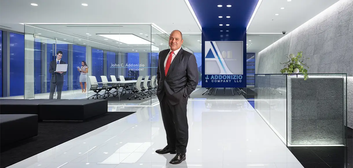 Businessman standing confidently in a modern office lobby.
